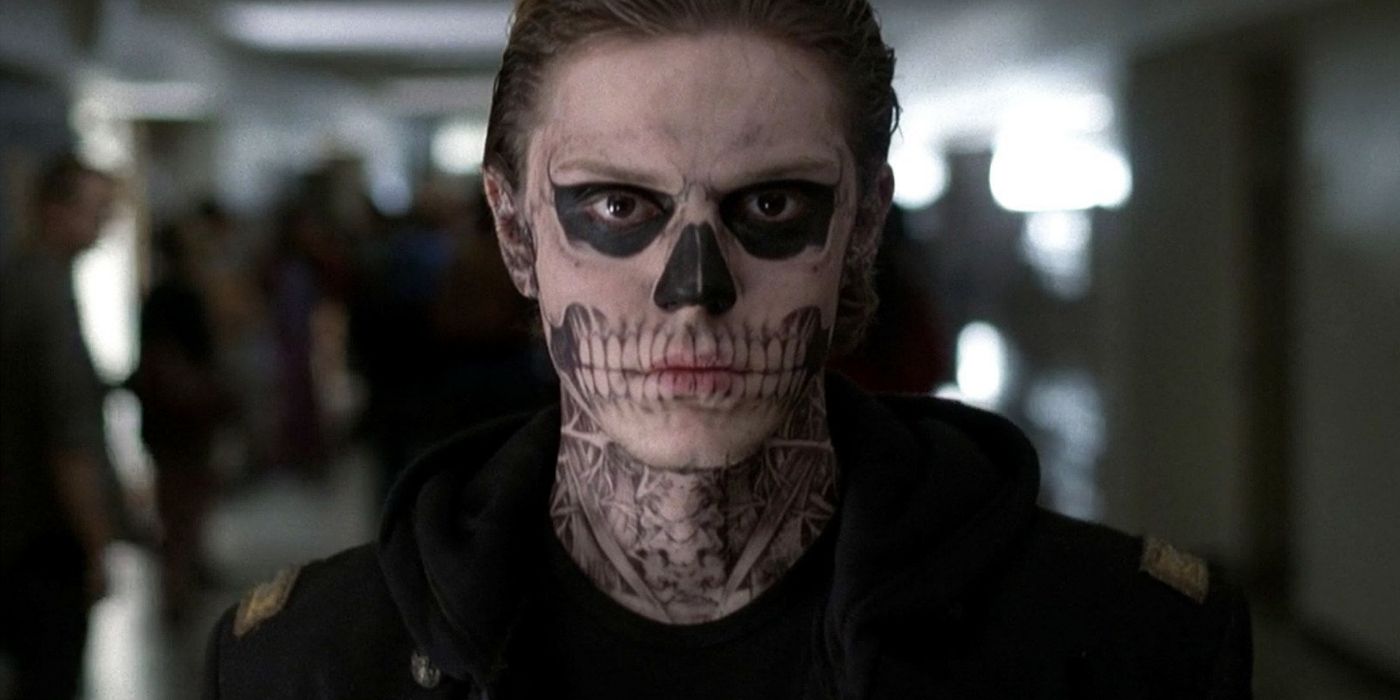 Evan Peters as Tate Langdon walking down hall in American Horror Story Murder House 