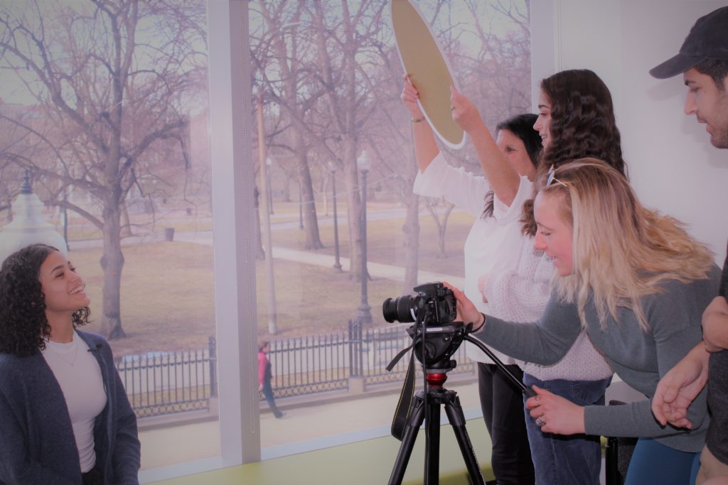 Students creating a promotional video for the 'On The Same Page’ virtual book campaign.