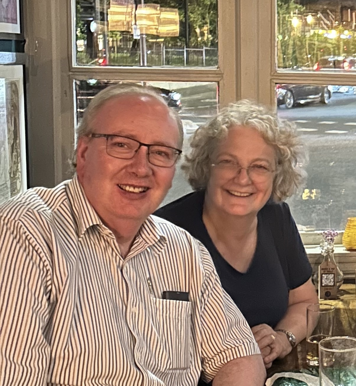 husband and wife smiling