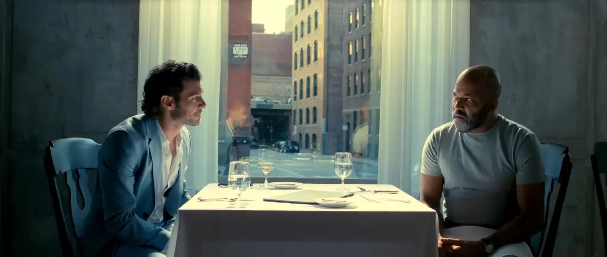 Monk and Wiley sitting across from each other in 'American Fiction'