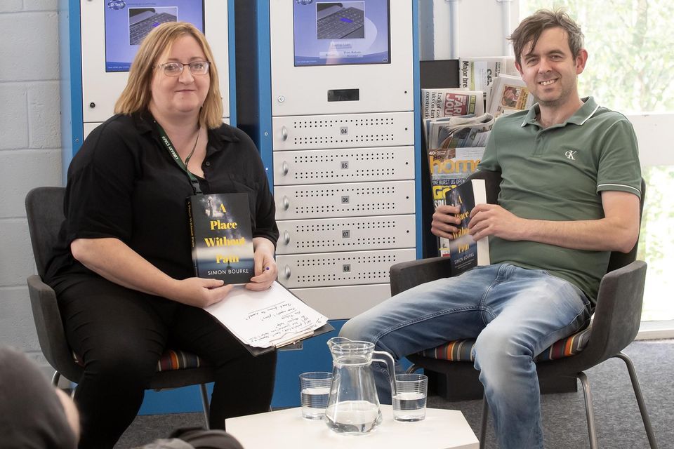 Simon Bourke talking about his new book to Tina Callaghan in New Ross library. Photo; Mary Browne