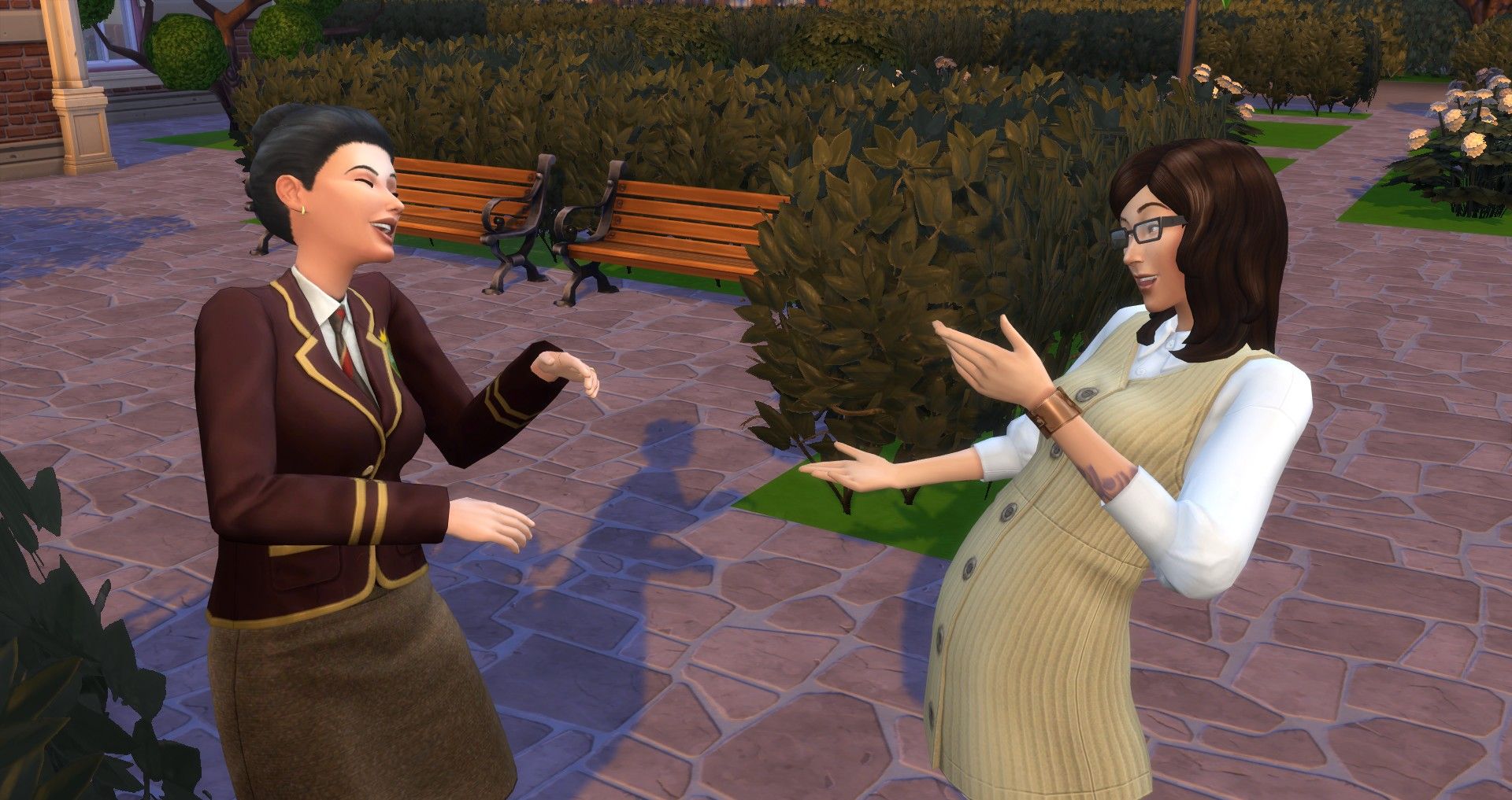two female sims laughing together outside the library in britechester during an interview in the sims 4 writer career