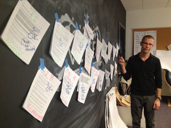 News director Josh Susong making edits to one of reporter Karina Bland's really long stories in 2013.