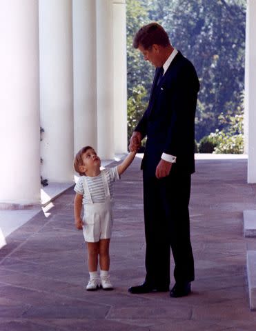 <p>John F Kennedy Library/Zuma Wire/Shutterstock</p> President John F. Kennedy and son John F. Kennedy Jr. at the White House on Oct. 10, 1963.
