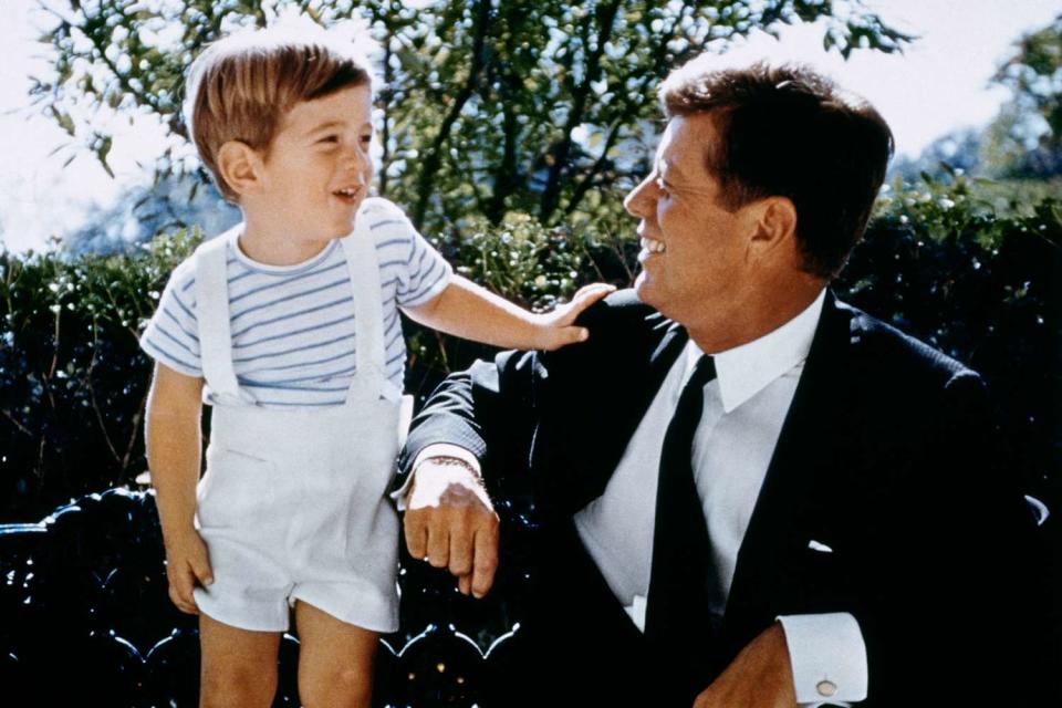 <p>Estate of Stanley Tretick LLC/Corbis via Getty</p> President John F. Kennedy with his son, John F. Kennedy Jr., one month before JFK
