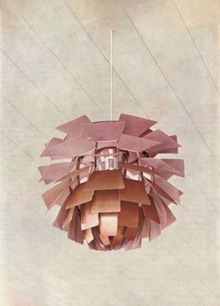 A close-up of the original PH Artichoke at Langelinie Pavilion. Its copper leaves were lightly brushed and lacquered on the outside, and coated with a reflective layer of pale pink paint on the inside, to achieve a rosier glow that would complement the skin tones of Langelinie Pavilion’s guests.