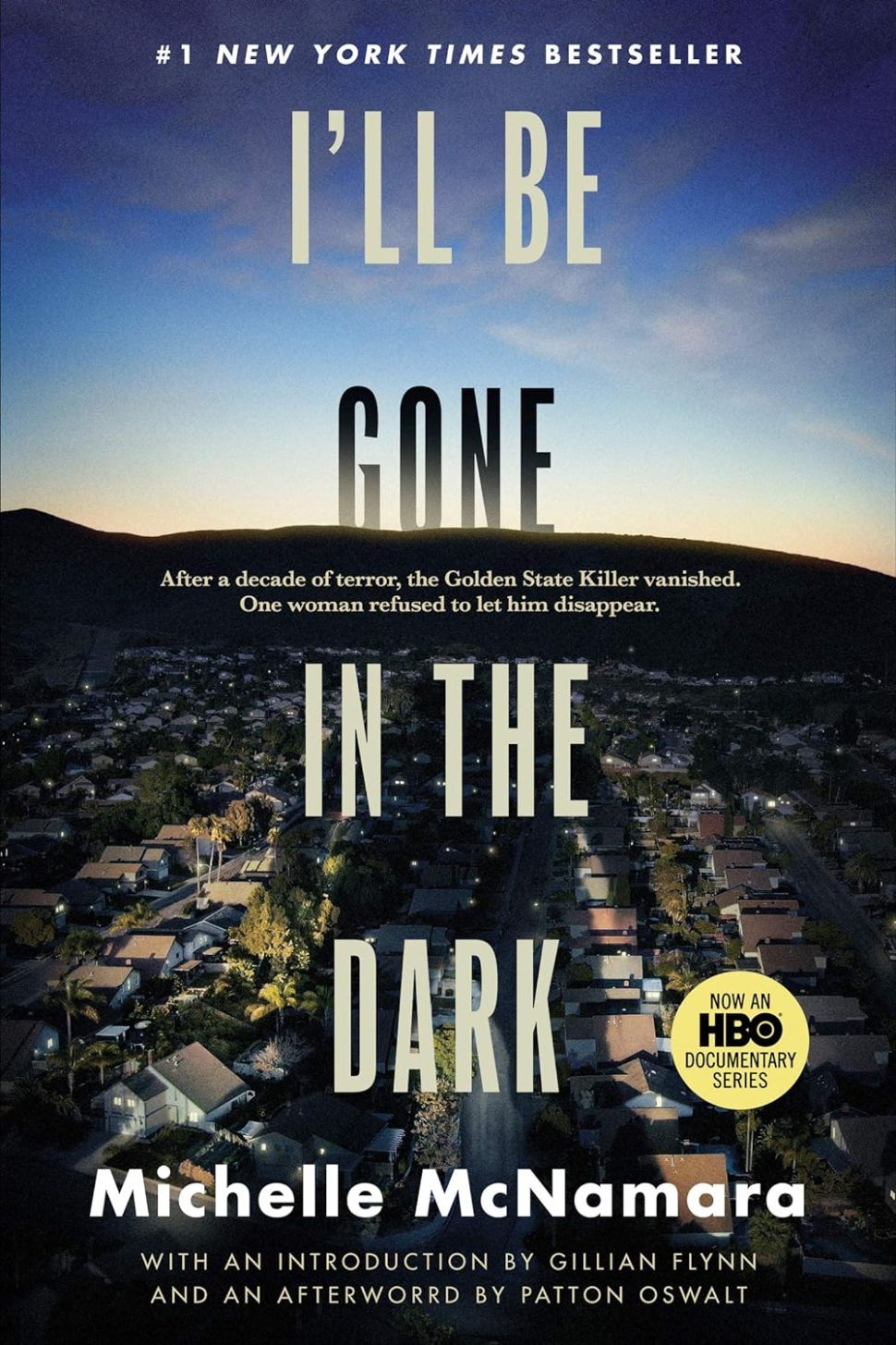 A book cover with a long shot of a hill under a blue sky