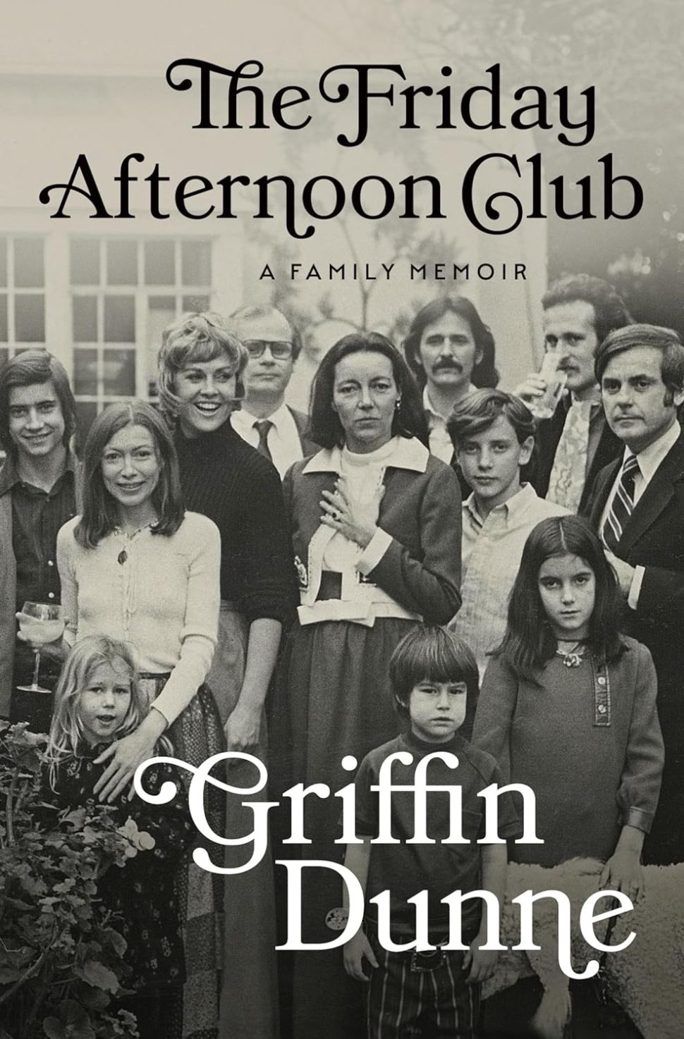A book cover featuring a black and white photograph of a large family with lots of children