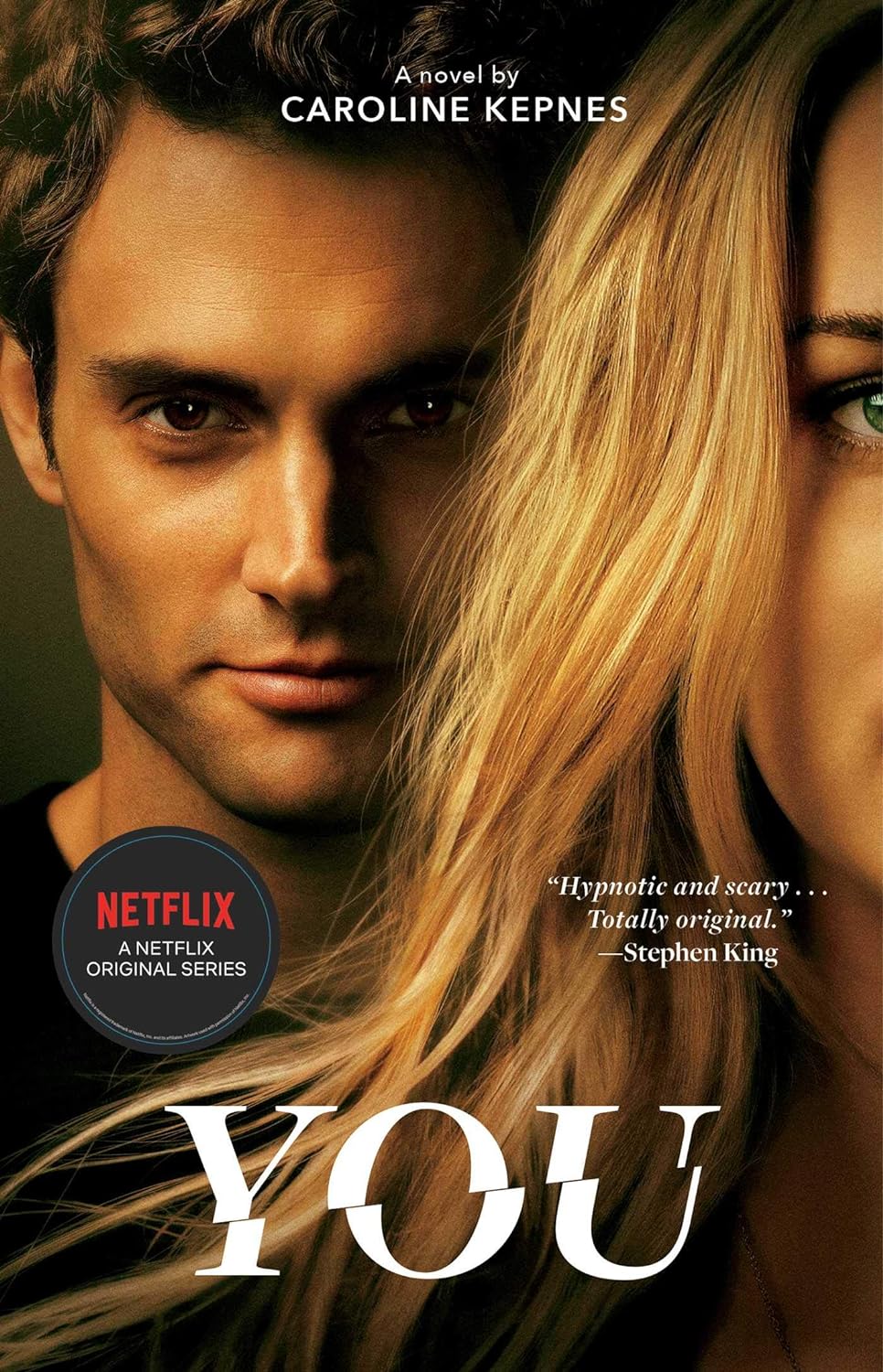 A book cover with a man standing behind a woman; he's staring creepily