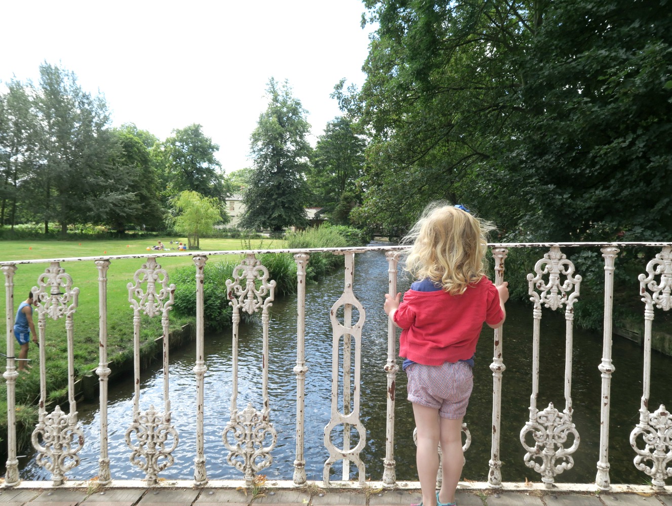 My daughter on the bridge at Morden Hall park, where we've played Pooh sticks - a fun option for fans of Winnie the Pooh