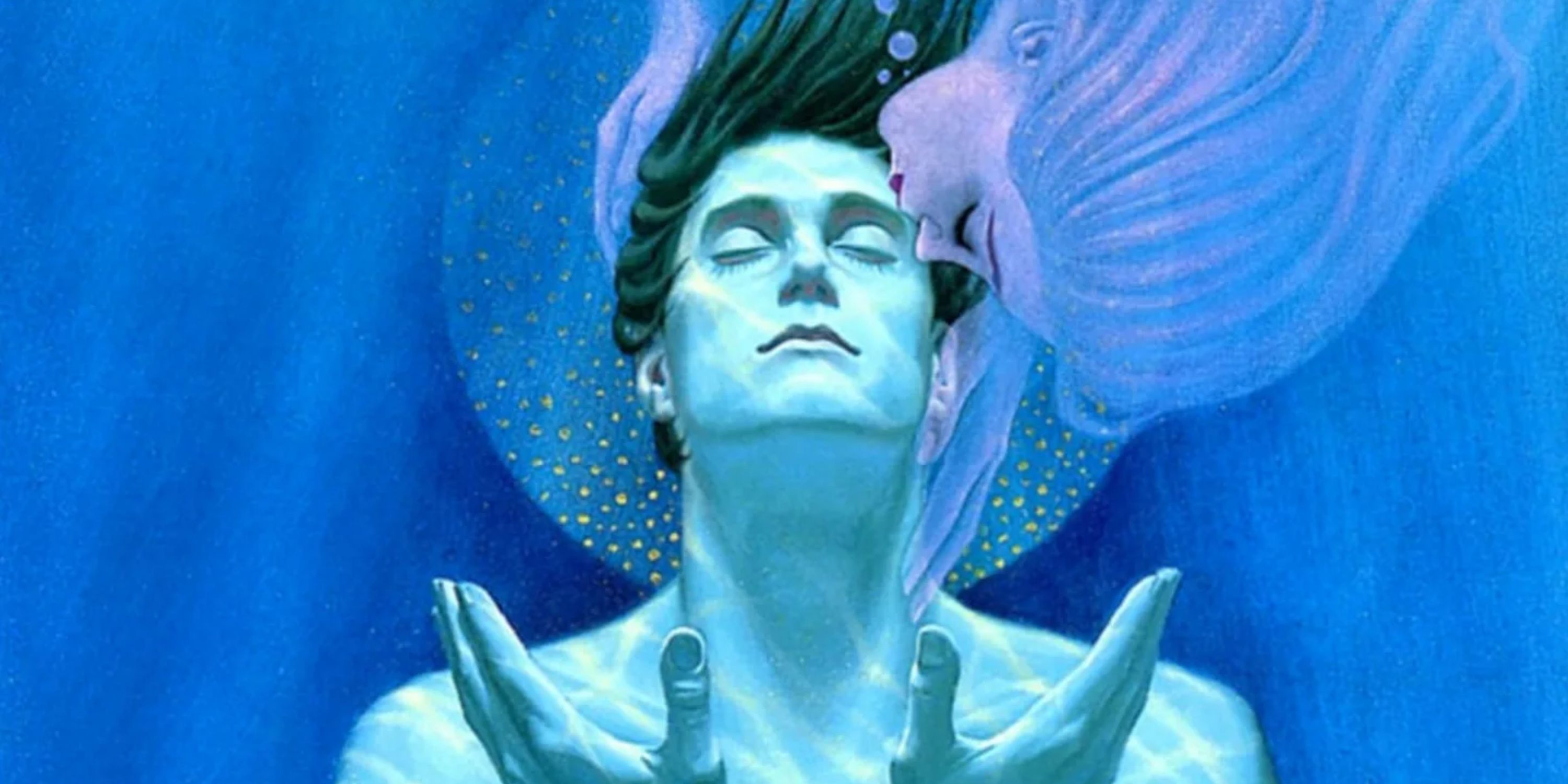 A man underwater getting kissed by a mermaid
